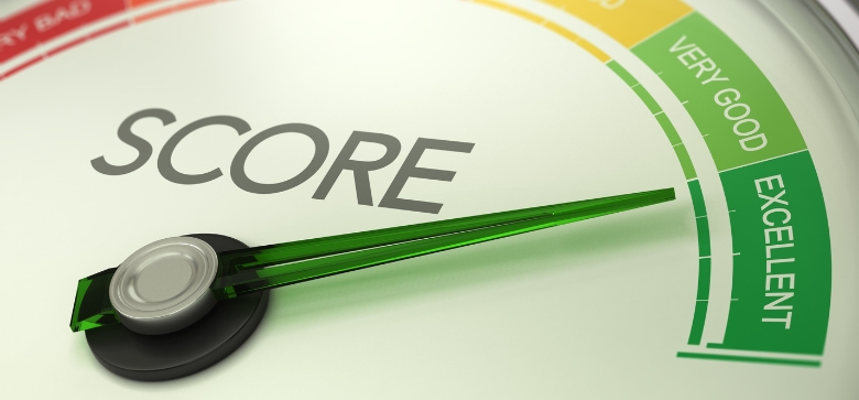 A person reviewing credit report on laptop with a checklist and rising credit score chart