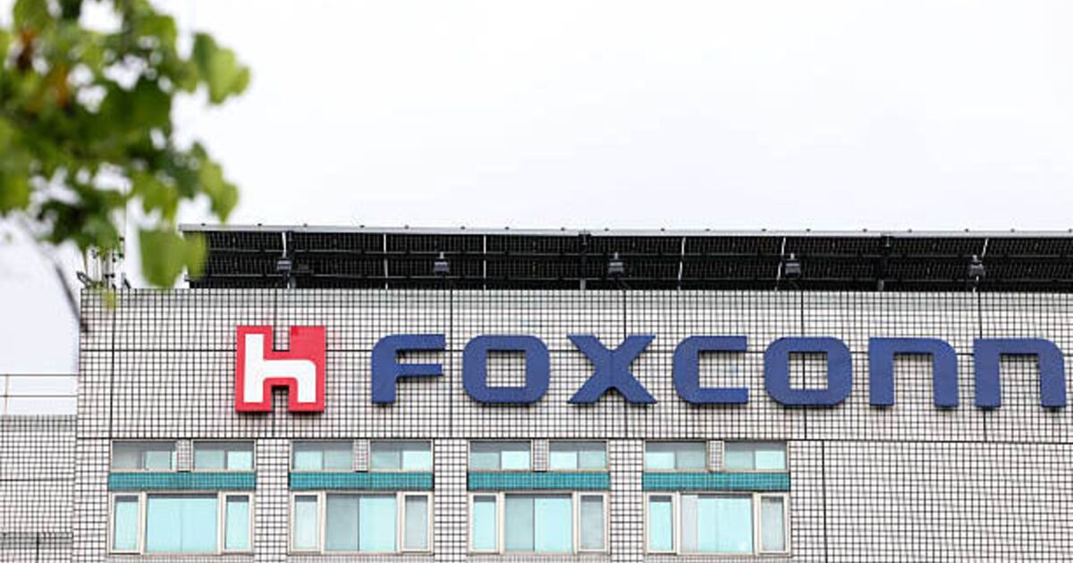 Foxconn factory gate in India with Chinese engineers exiting amid staffing changes