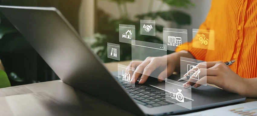 Man calculating savings from loan prepayment using a laptop and Vizzve Finance EMI calculator