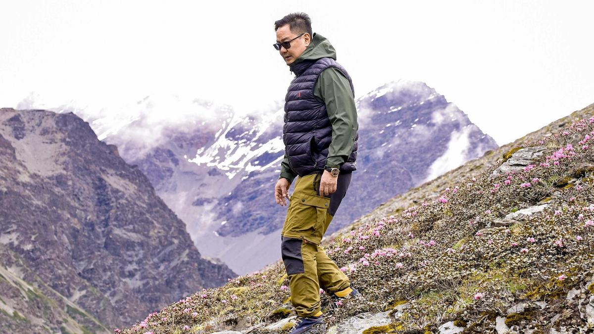 Dalai Lama addressing followers; Rijiju affirms his authority over reincarnation decision