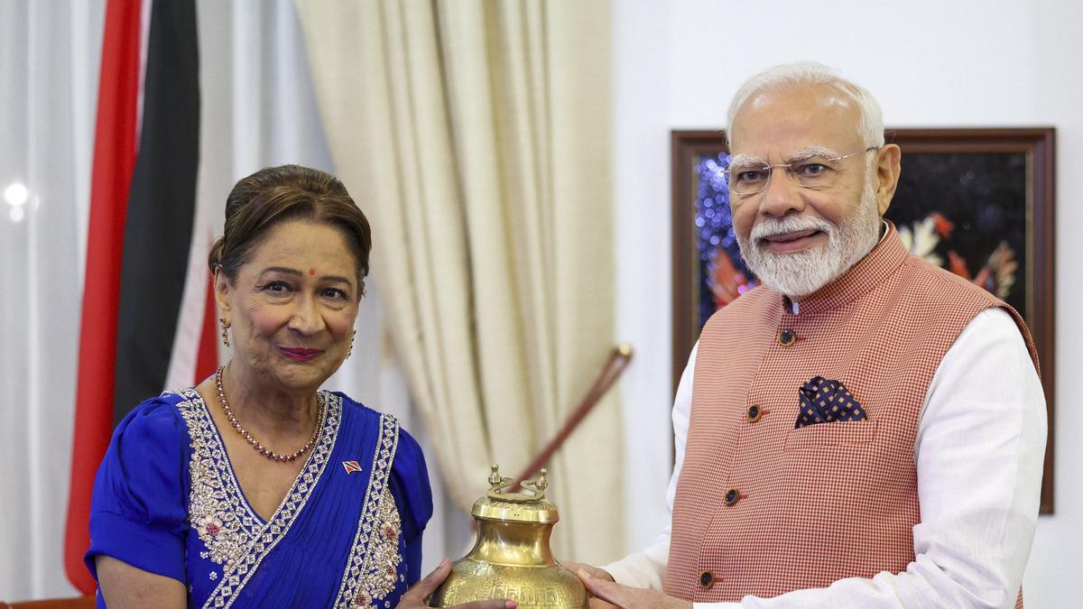 PM Modi presenting holy water from Mahakumbh and Ram Mandir replica to Trinidad & Tobago Prime Minister