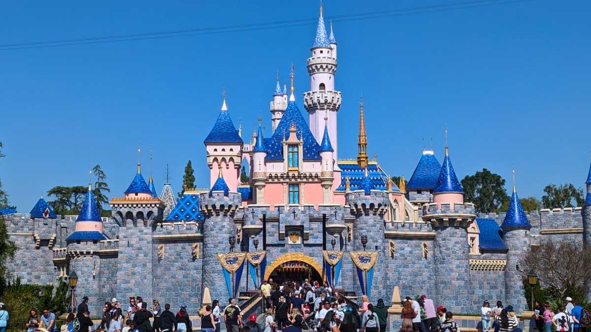 Concept art of Disneyland-style theme park in Haryana with Indian families, roller coasters, and Haryana’s skyline.