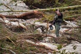 Texas residents wade through floodwaters as rescue teams assist during statewide flooding in 2025