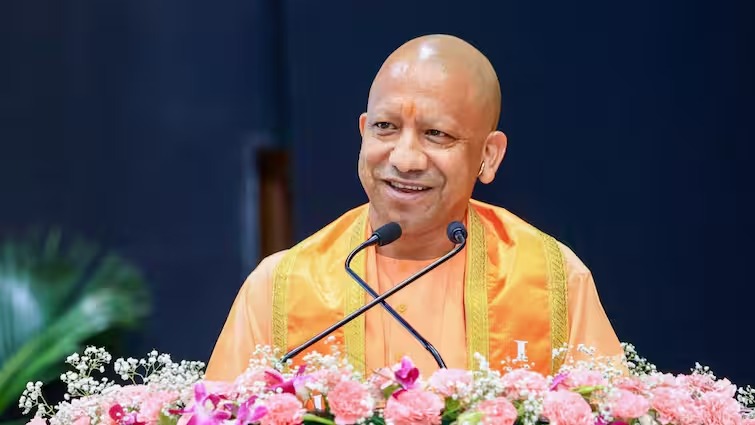 Yogi Adityanath with schoolgirl amid fee waiver controversy