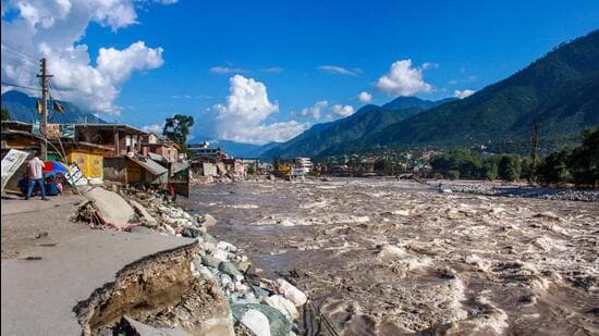 Submerged house and vehicle in floodwater in Himachal Pradesh