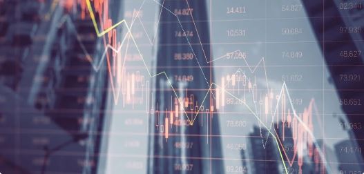 "Stock trader watching falling Nifty50 and Sensex charts on a digital screen"