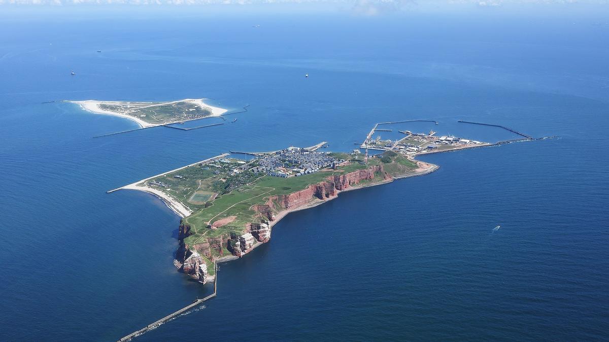Aerial view of Helgoland's red cliffs and surrounding blue waters