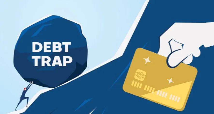 Stressed Indian man looking at credit card bills with Vizzve app open for financial help