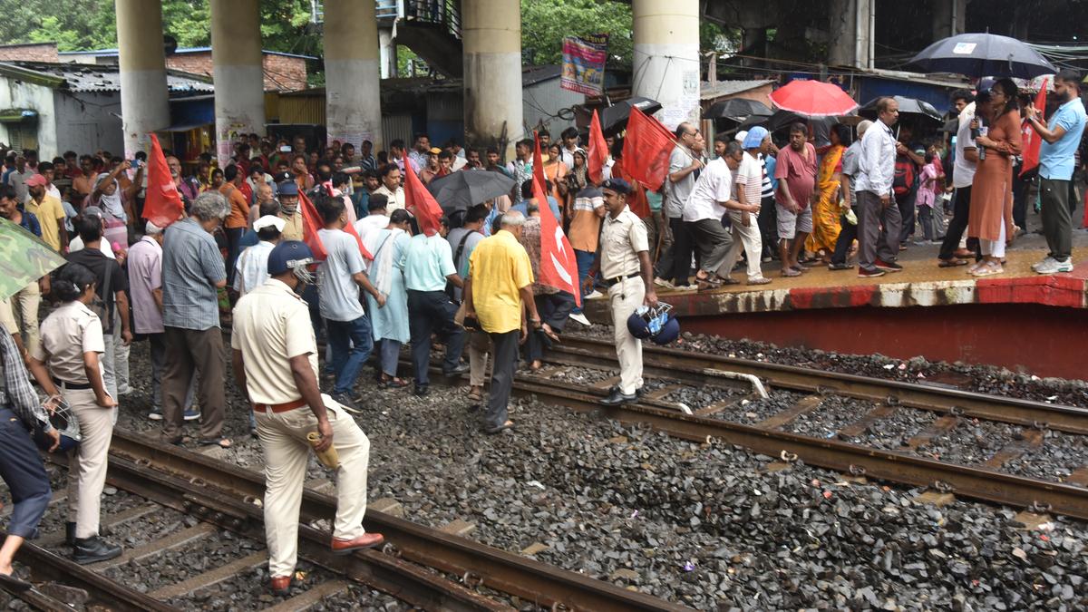 Protesting trade union workers holding banners during strike