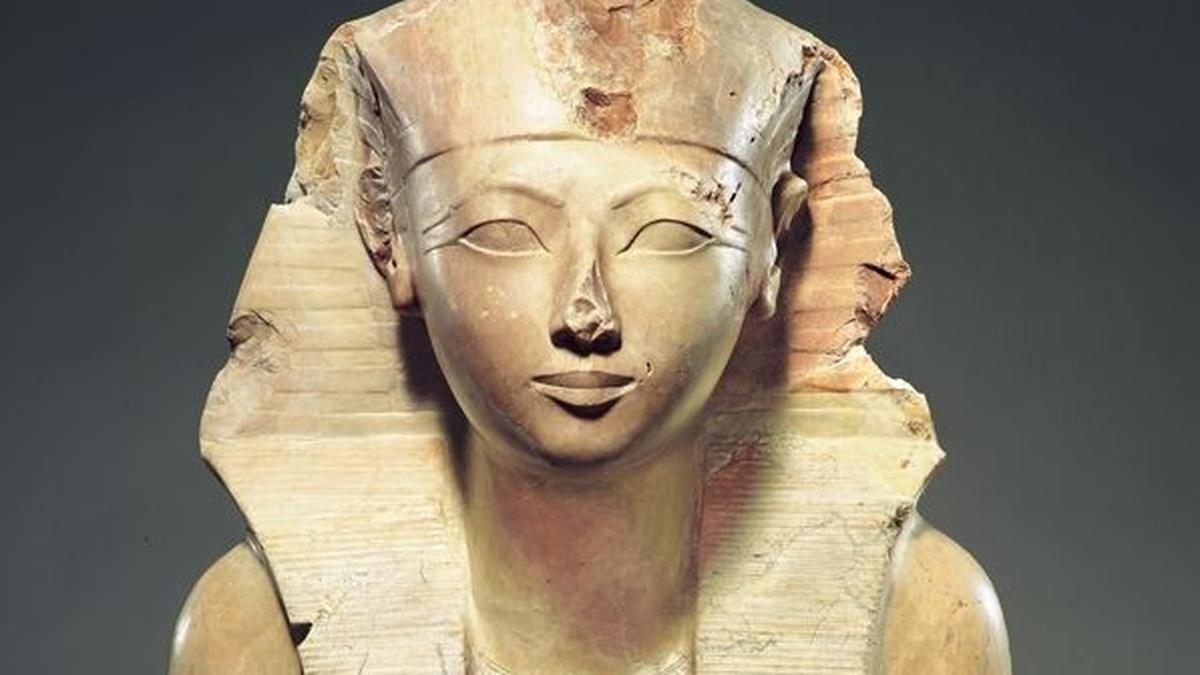 Broken statue fragments of Queen Hatshepsut at an archaeological site