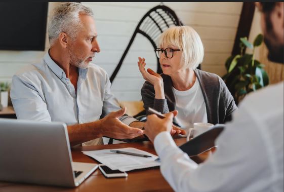 "Senior couple reviewing pension documents and planning retirement together"