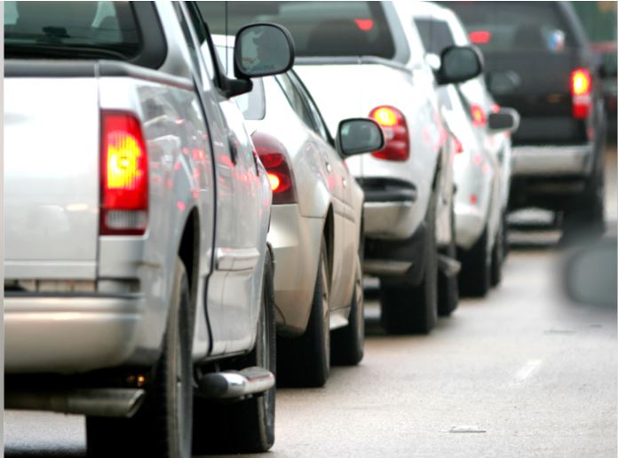 "Crowd gathers at Freedom Park Bengaluru during Bharat Bandh causing traffic congestion and road closures"