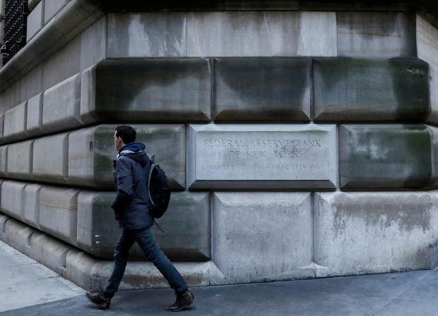 People walking near a financial district representing US consumer sentiment and economic stability