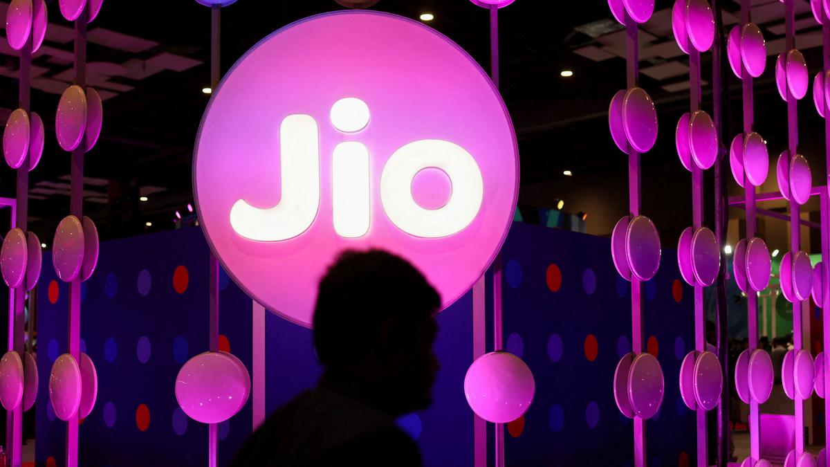 Reliance Jio logo with financial charts indicating IPO delay