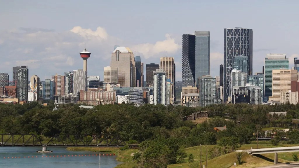 Immigration documents and Canadian dollars showing proof of funds requirement