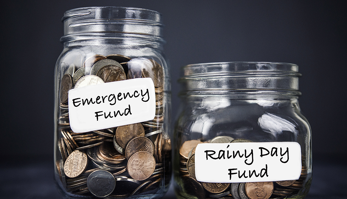 A split image of a piggy bank with an umbrella and a broken piggy bank with hospital bills, illustrating the difference between rainy day and emergency funds