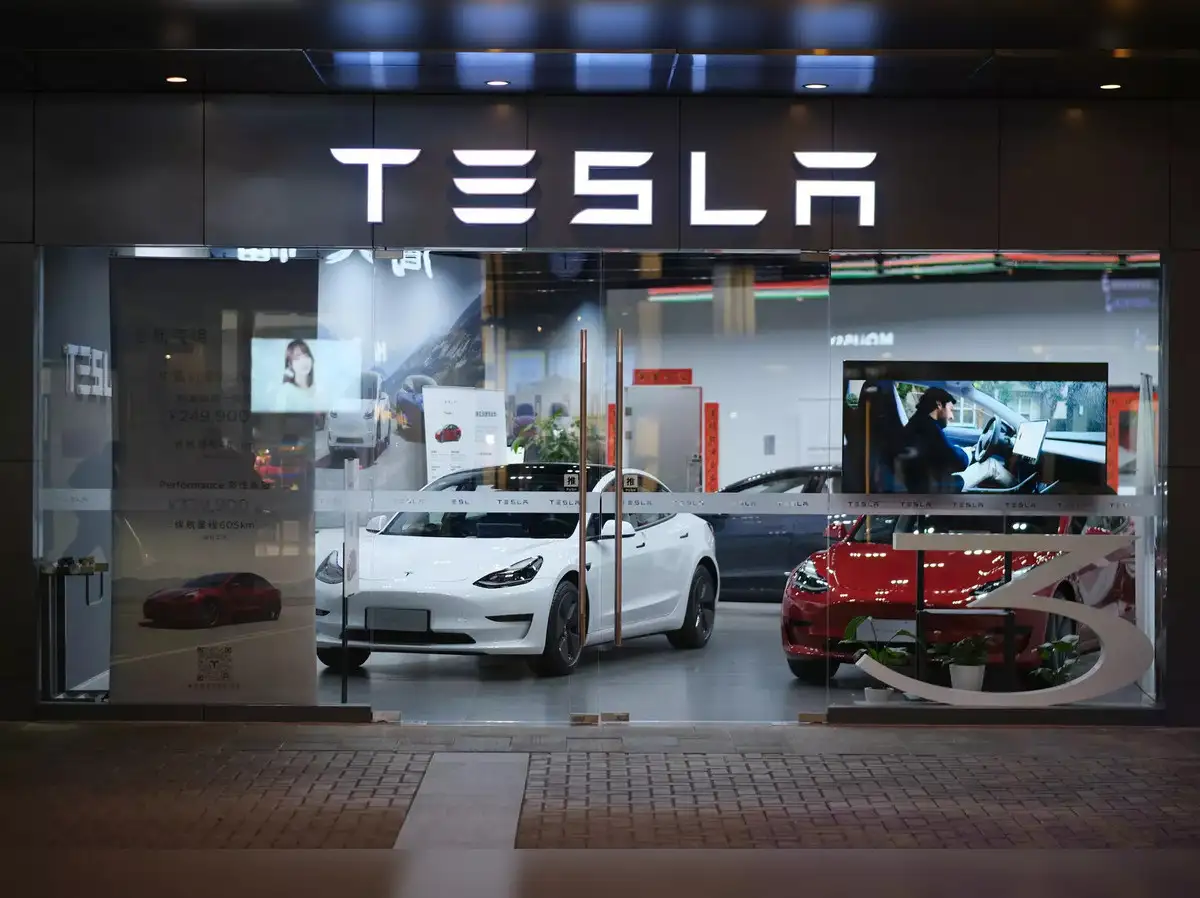“Tesla experience center exterior in Mumbai showcasing electric vehicles and customer engagement”