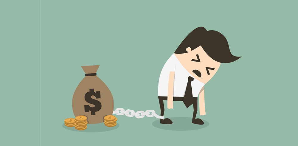 Young Indian adult surrounded by bills and shopping bags, looking stressed about money decisions