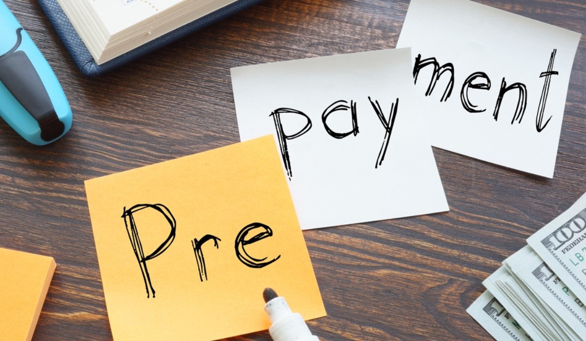 A person breaking a chain labeled “Loan EMI” with a golden rupee symbol flying out — Vizzve Finance