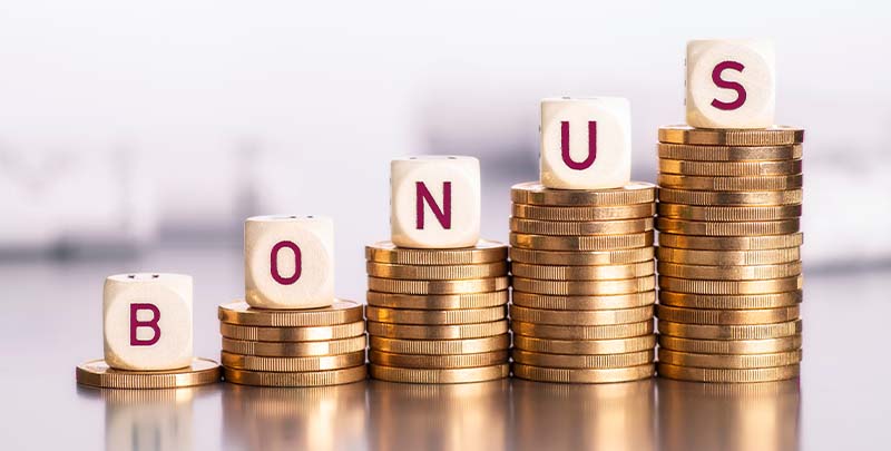 An Indian employee receiving a festive bonus envelope, with icons for shopping, saving in a piggy bank, and SIP investments above.