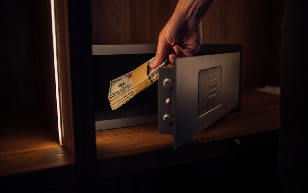 Indian currency notes in a steel locker with emergency fund label