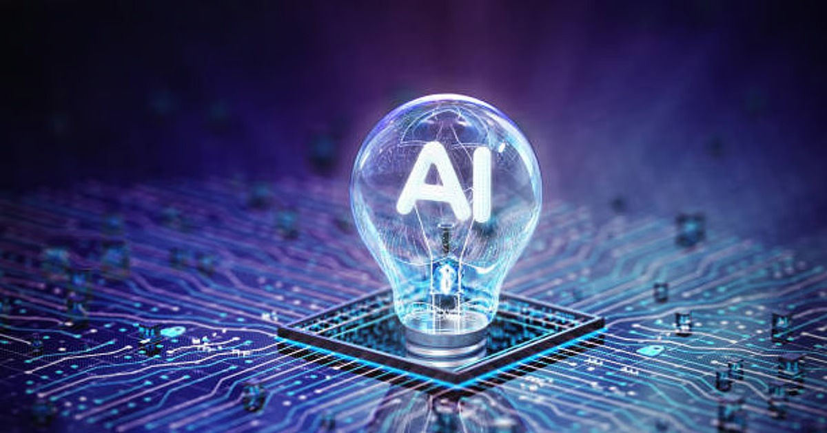 Young Indian professional working on a laptop with futuristic AI graphics and a financial planning notebook.