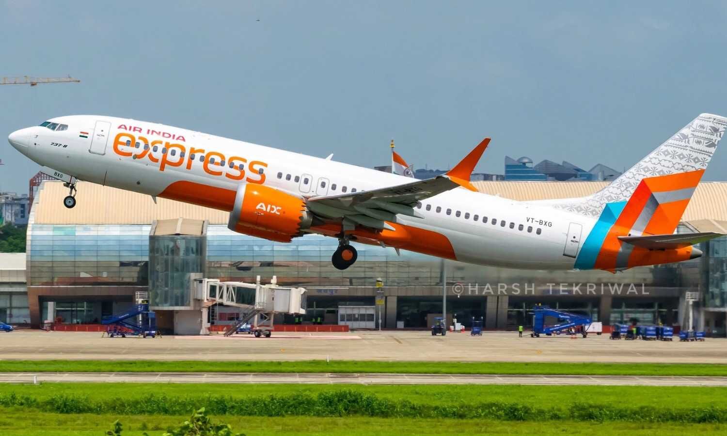 Air India Express aircraft on the tarmac with passengers waiting, showing the disruption of the Hyderabad-Phuket flight due to technical issues.