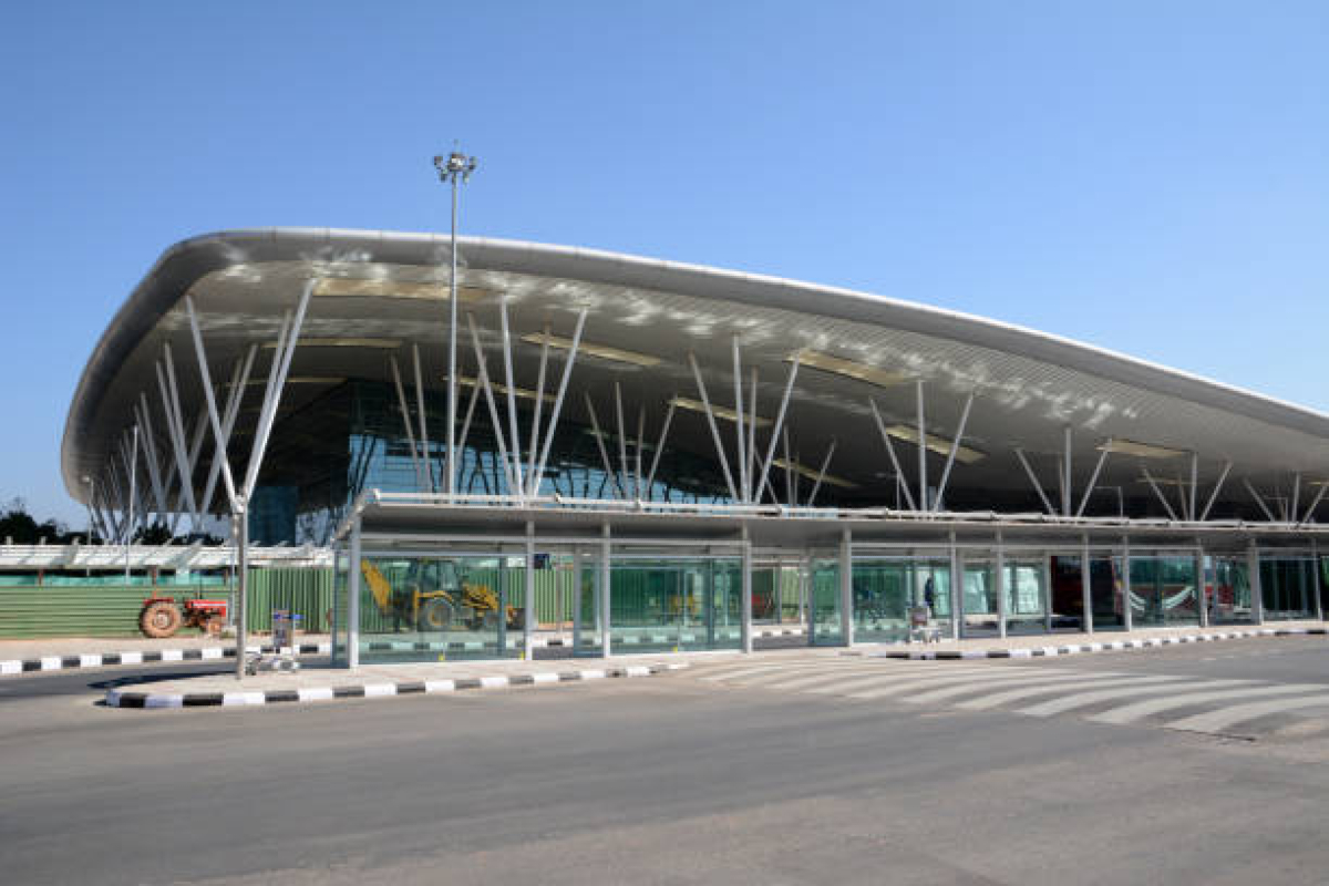 A newly constructed terminal at Halwara Airport in Ludhiana, with runway and signage, ready for commercial flights.