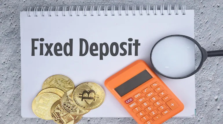 Indian man using mobile banking to take loan against FD, Vizzve finance branding.