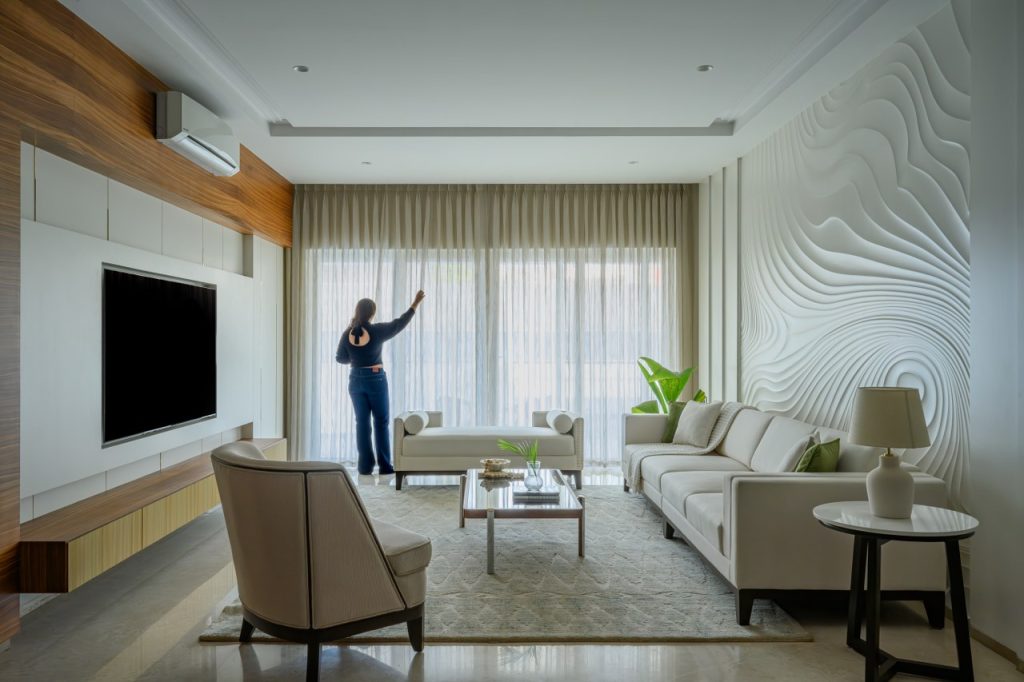 A peaceful, clean minimalist room with neutral tones and a person journaling finances. Text overlay: “Minimalist Living = Financial Freedom – Vizzve”.