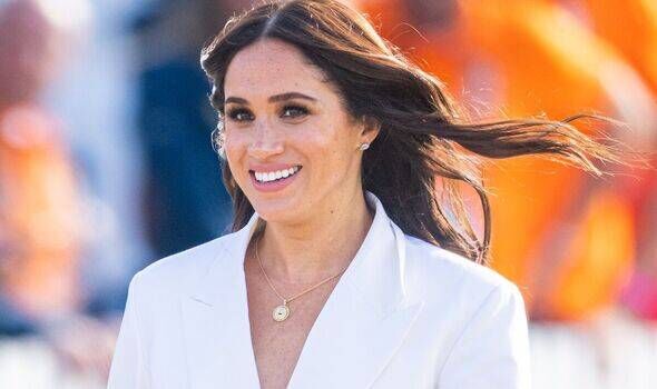 Meghan Markle in a soft-focus kitchen scene,