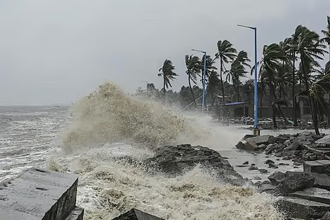 Satellite image of a cyclone approaching the Indian coastline with alert systems active.