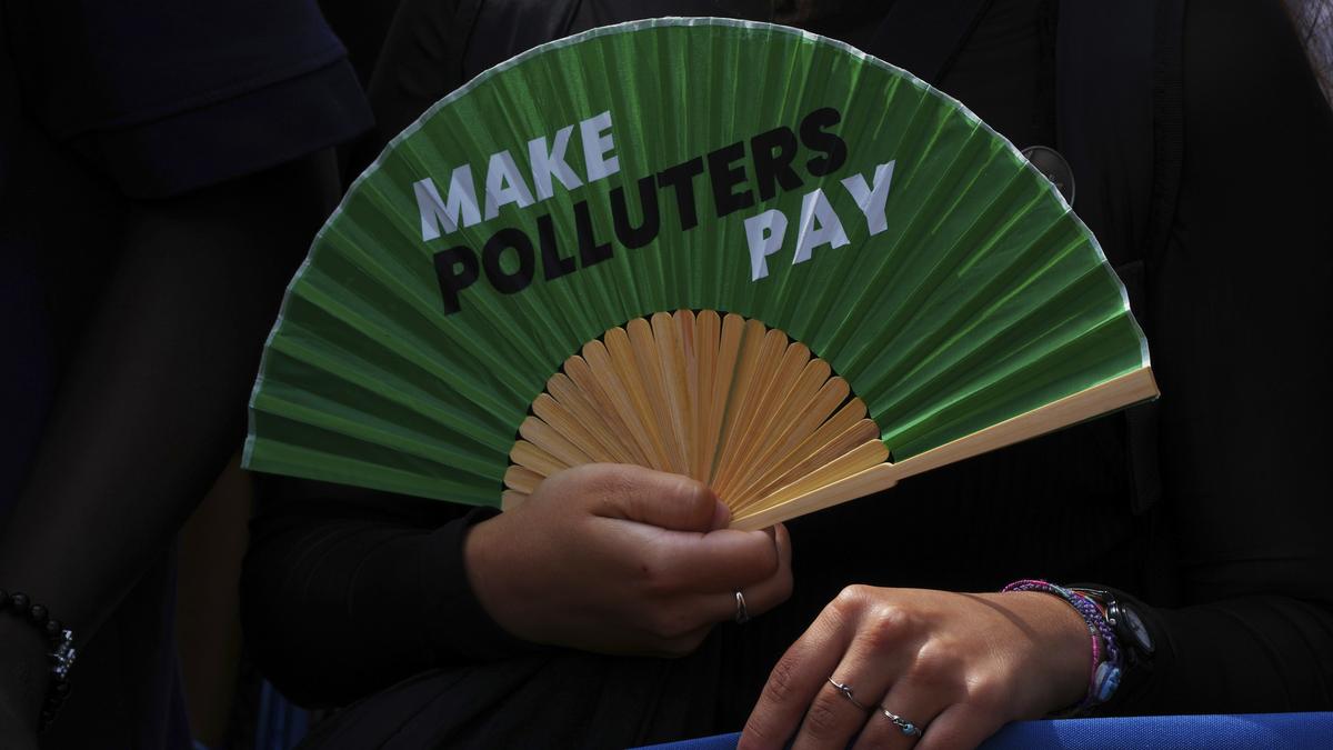 International Court of Justice emblem with a backdrop of industrial emissions highlighting climate accountability