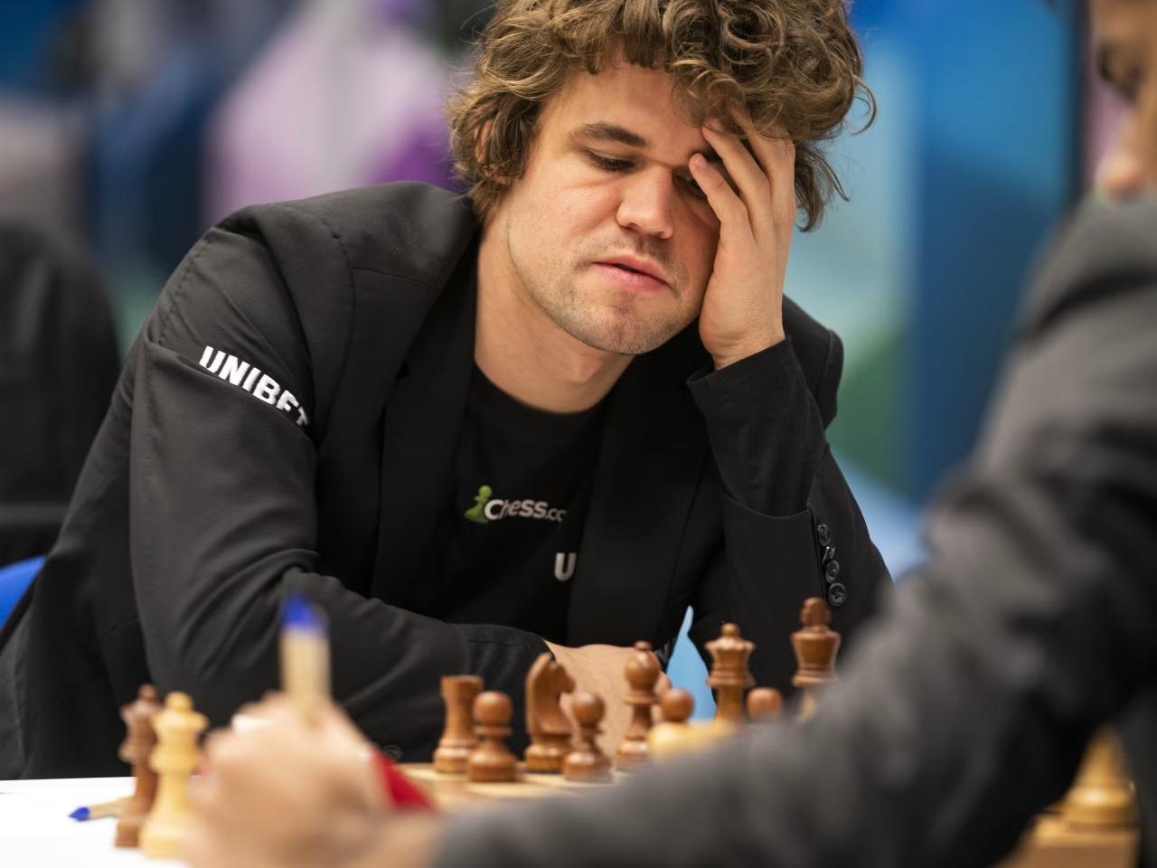 Magnus Carlsen walks away from chess board during live match with Hikaru Nakamura