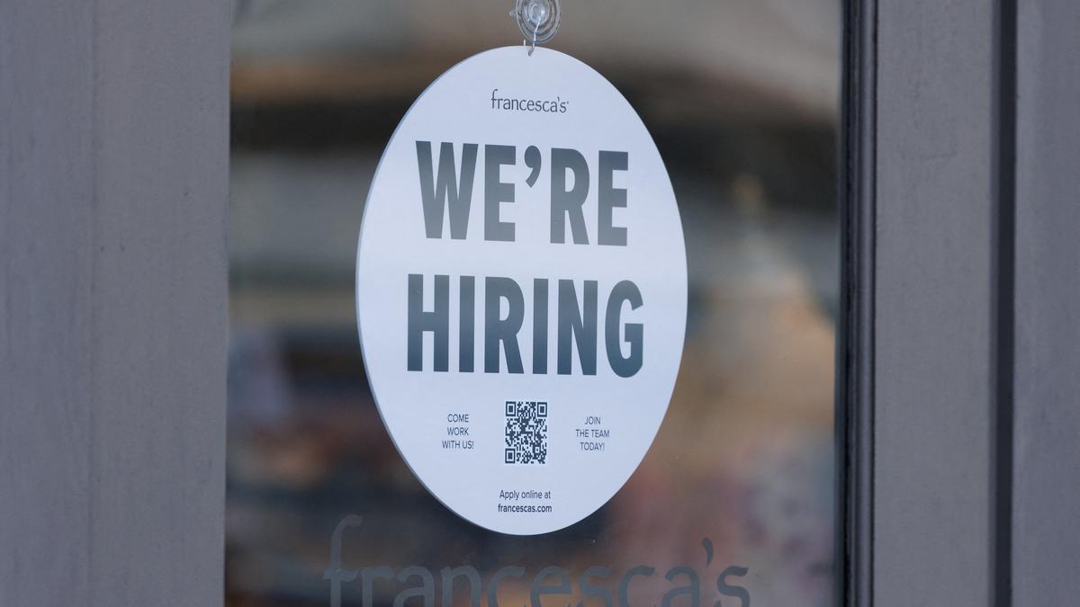 Graph showing decline in U.S. job growth with overlay of U.S. flag and trade tariff symbols illustrating impact of Trump's trade policy on hiring