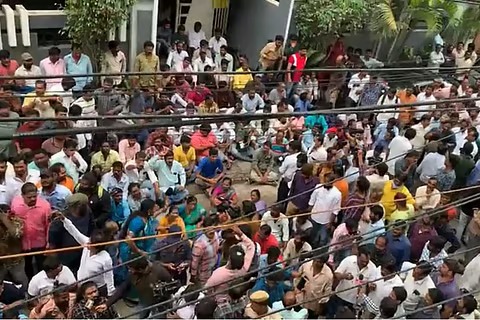 Tollywood crew members protest outside a studio with placards demanding fair wages