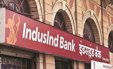 IndusInd Bank building with a banner featuring Sumanth Kathpalia, the reappointed MD & CEO