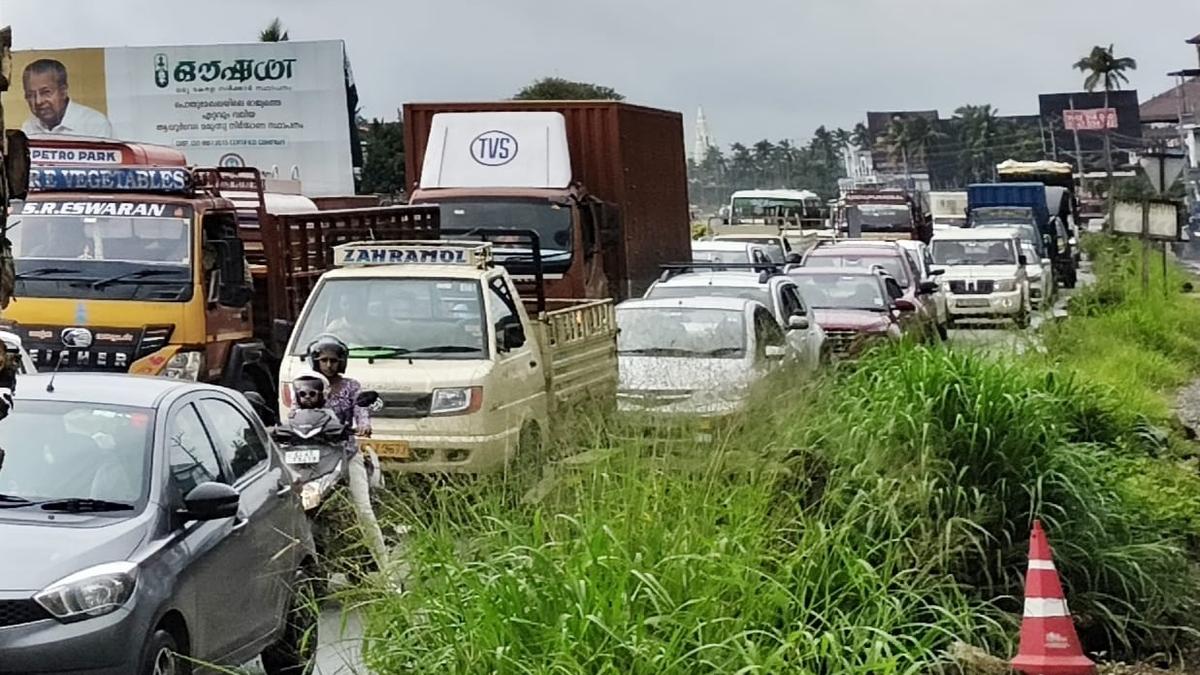Kerala High Court building with police and public outside, highlighting suspension of toll collection at Paliyekkara Toll Plaza amid traffic chaos