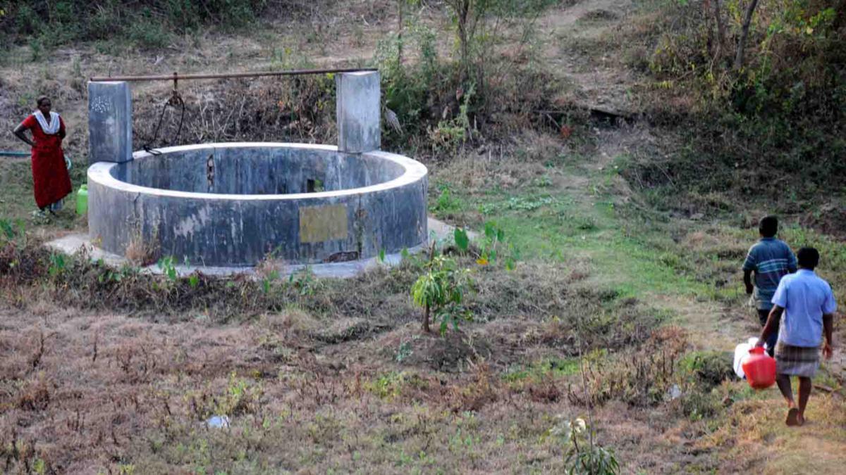 A rural well in Kerala with water sample testing to check contamination, reflecting groundwater pollution concerns in 10 districts