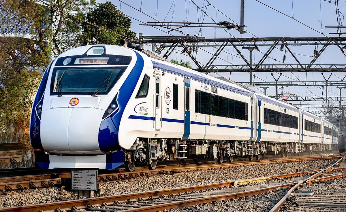 Vande Bharat Express train speeding on Indian railway tracks with modern design