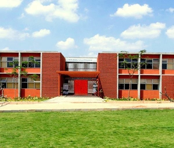 School building with students and a rising fee chart overlay