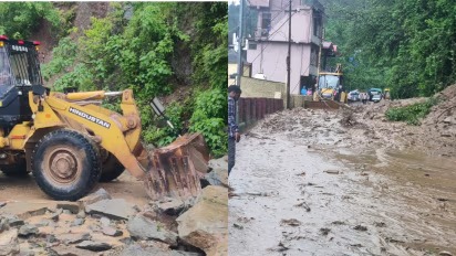 Flooded rural road in Kullu district with debris and mud after heavy rainfall.
