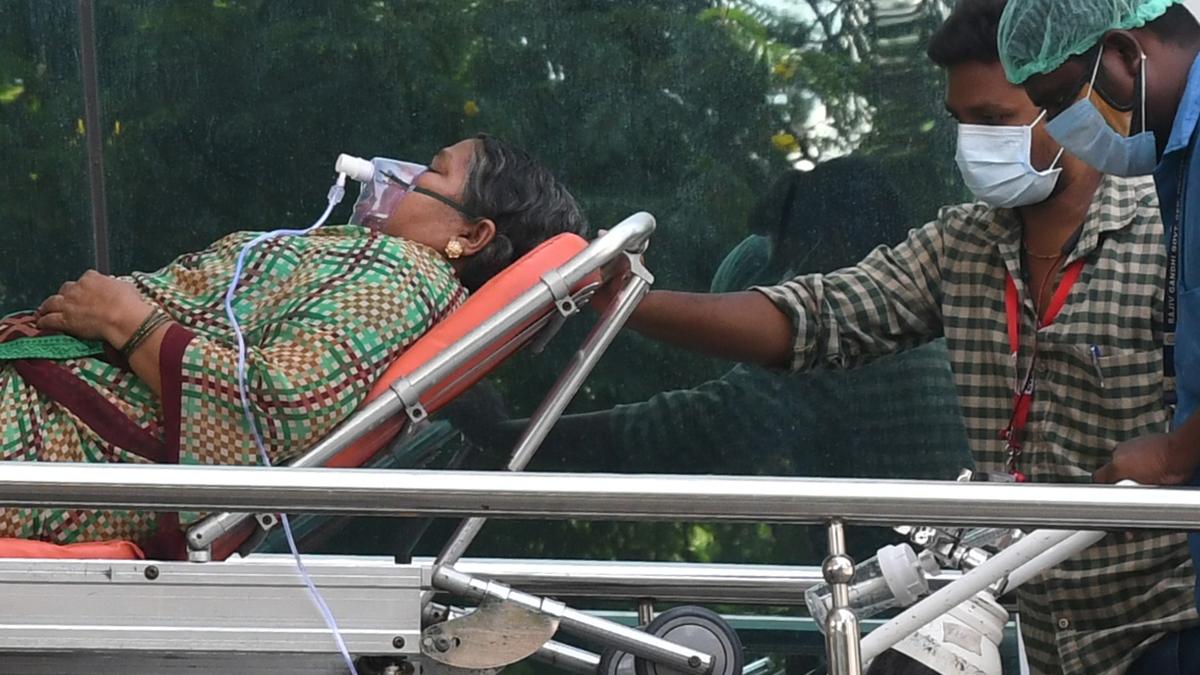 Frustrated patient navigating the complicated hospital referral process in India amidst healthcare overcrowding and systemic inefficiencies