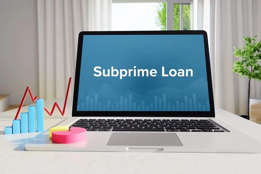 Person reviewing loan documents about subprime loans, Vizzve Finance branding