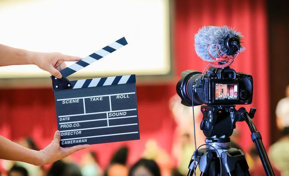 Film crew shooting a scene at India Gate, Delhi
