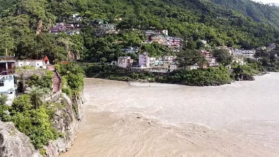 Uttarakhand villagers evacuating after IMD red alert warning for heavy rainfall.