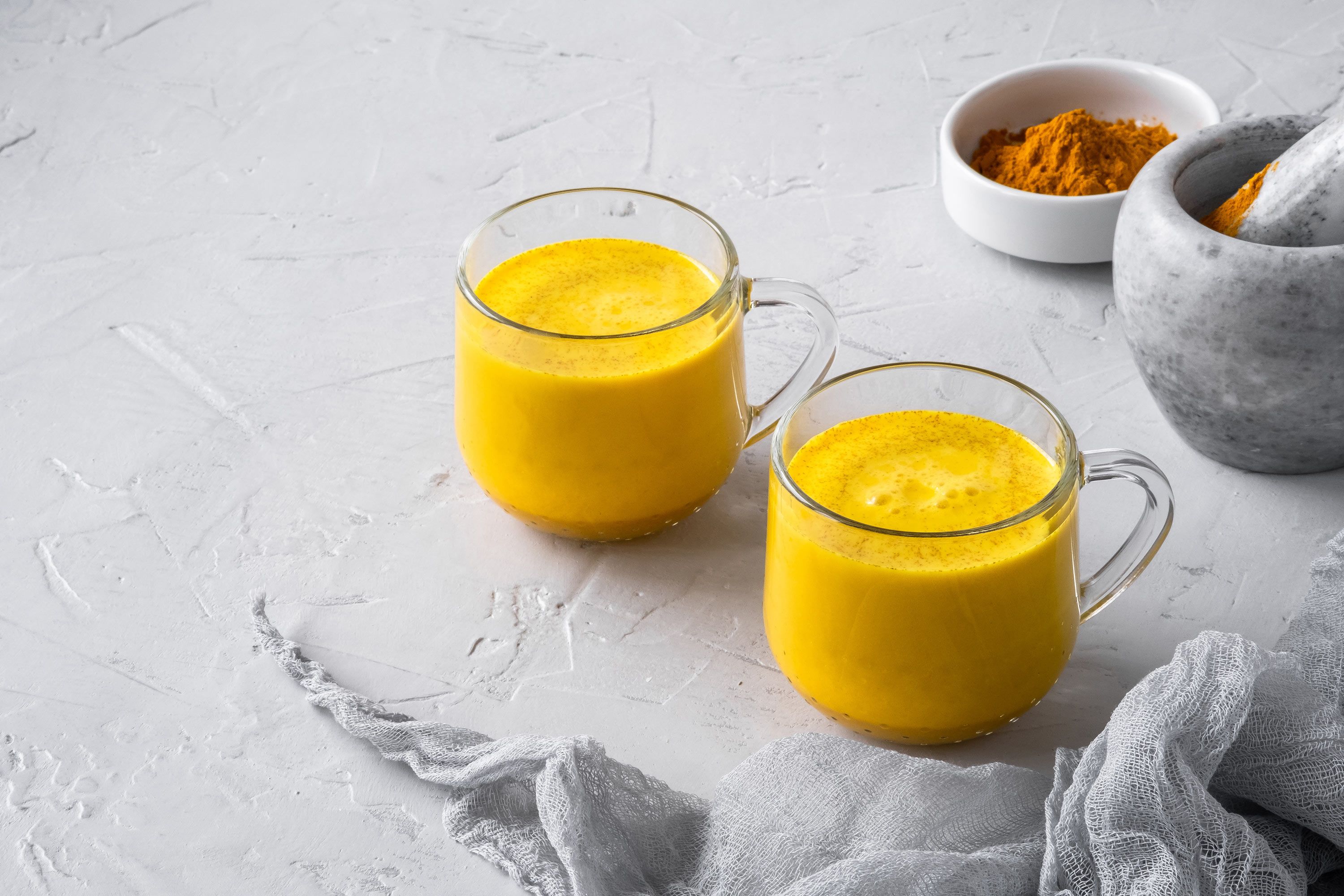 Warm turmeric milk in a cup, promoting relaxation and better sleep
