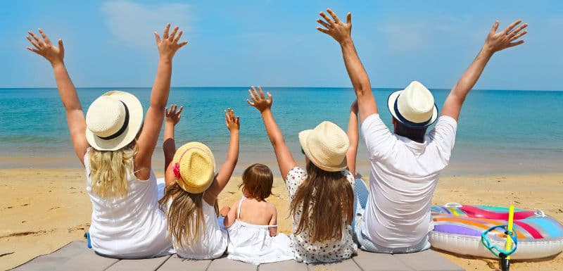 Family enjoying dream vacation after taking a travel loan