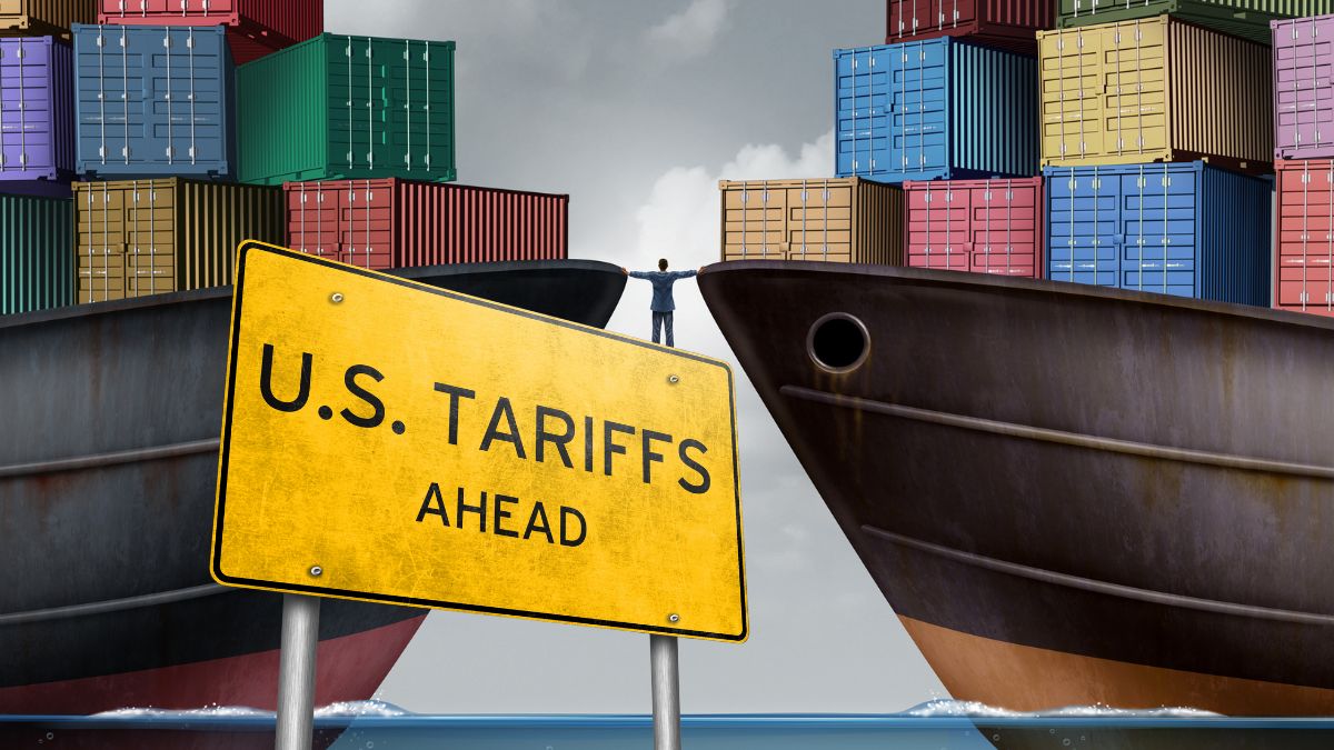 Illustration of small business owner facing U.S. tariffs with India credit guarantee support