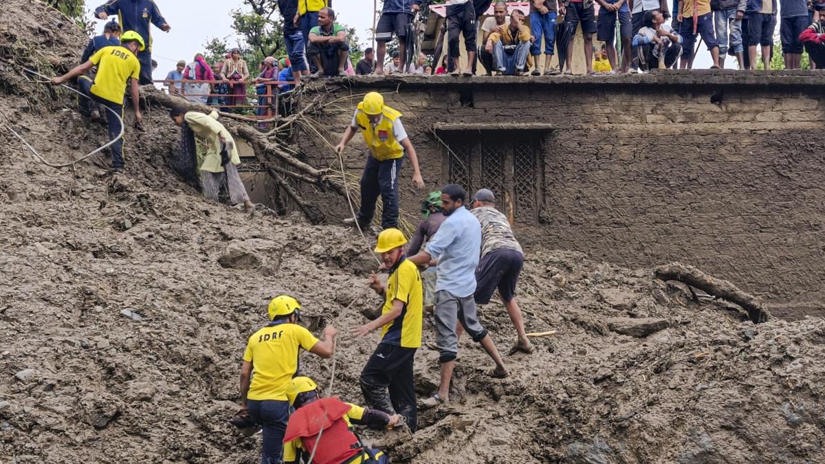 Flood-affected area in Uttarakhand after heavy rainfall, with rescue teams and villagers stranded due to landslides